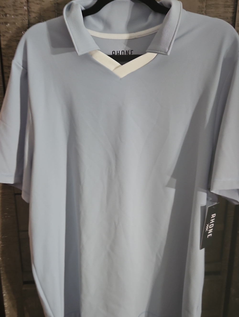 RHONE Links Golf Polo Men's Light Blue Polo with White V-Neck Trim